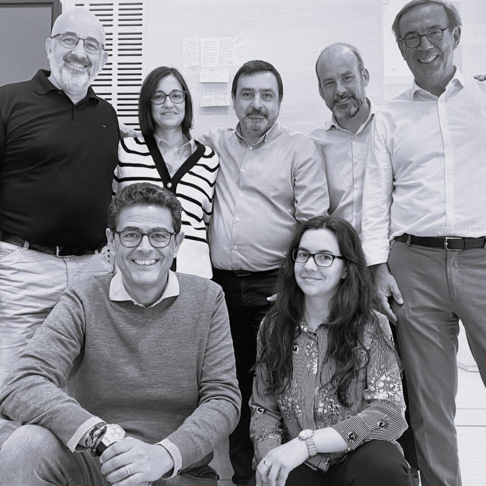 A team of seven colleagues photographed together